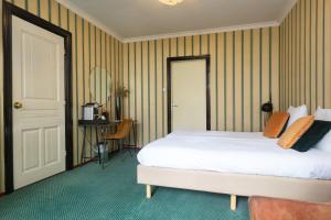 Voodi või voodid majutusasutuse Hotel Johannes Vermeer Delft toas