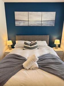 a bedroom with a bed with two pillows on it at Blackpool Abode - 20 Bairstow Street in Blackpool