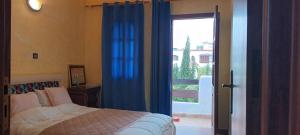 Postel nebo postele na pokoji v ubytování Complexe Mouna Cabo Negro