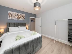 a bedroom with a large bed and a window at Pass the Keys Brand New Stylish 2BR Flat in Reading Centre in Reading