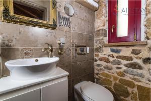 a bathroom with a sink and a toilet at Orianna Apartment Airport by Airstay in Spáta +19 photos