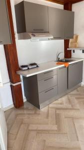 A kitchen or kitchenette at Angela - Zoi Rooms