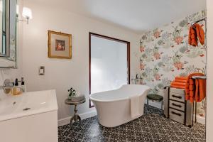 a white bathroom with a tub and a sink at Nave House - Norfolk Cottage Agency in Fakenham