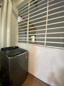 a room with a trash can and a window at One Residence Sekinchan 适耕庄无敌海景 in Sekincan