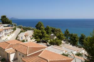 a beach with a view of the ocean at Alonissos Beach Bungalows And Suites Hotel in Alonnisos