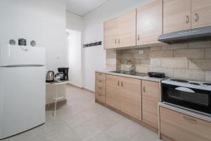 Kuchyň nebo kuchyňský kout v ubytování Athenais Apartment