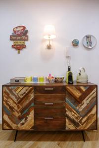 a cabinet with wooden drawers in a room at Domus Angioina in Naples