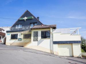 a building on the side of a street at Beautiful Holidayhome with sauna and terrace in Harscheid