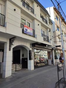 a building with a sign on the side of it at Lofts Patagonia Mitre 3 in San Carlos de Bariloche