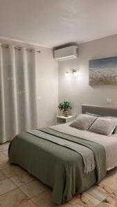 a bedroom with a large bed and a window at Lagos Apartment Sea View in Lagos