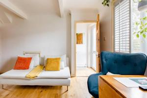 a room with a bed and a desk and a chair at Littlehaven in Roffey