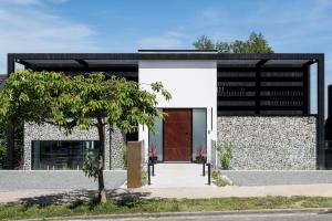 a house with a black and white facade at Grand Designs Chess Valley Project - Rickmansworth in Rickmansworth
