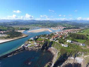 an aerial view of a town next to a river at Apartamento Felisa B in San Vicente de la Barquera