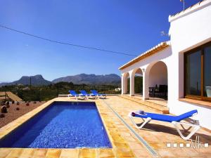 a villa with a swimming pool and a house at VH CostaBlanca - OSALVA in Benissa
