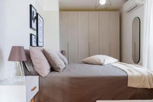 A bed or beds in a room at Exclusive penthouse with 60 m2 panoramic terrace