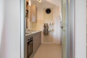 A kitchen or kitchenette at Exclusive penthouse with 60 m2 panoramic terrace