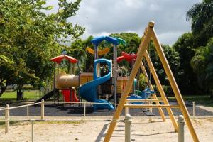 a playground with a slide in a park at Smart villa @ Richmond in Richmond