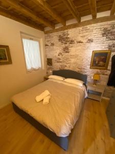 A bed or beds in a room at 30 San Gottardo House