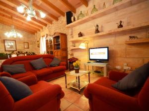 A television and/or entertainment centre at Can Rovey, pool and gardens in Inca