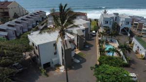 an aerial view of a resort with a palm tree at Labori Ballito in Ballito