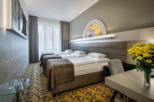 Hotel Essence客房内的一张或多张床位