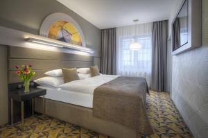 Hotel Essence客房内的一张或多张床位