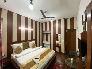 Postel nebo postele na pokoji v ubytování Golden Homestay
