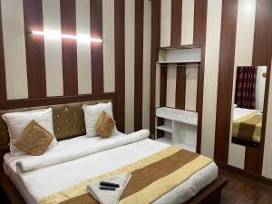 Postel nebo postele na pokoji v ubytování Golden Homestay