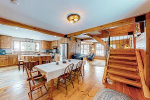 a kitchen and dining room with a table and chairs at Great Pond House in Belgrade