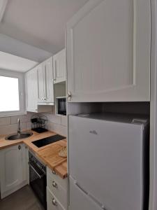 A kitchen or kitchenette at Casa playa