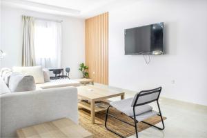 a living room with a couch and a table at Luxury and Modern Apartments in Mudhainib in Al Madinah