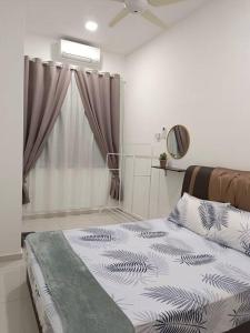 a bedroom with a bed and a window at TGG Homestay with Netflix in Kuala Terengganu