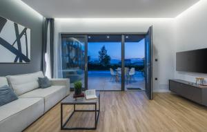 a living room with a couch and a tv at Villa Dual in Sveti Petar u Šumi