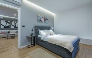 a bedroom with a king sized bed and a living room at Villa Dual in Sveti Petar u Šumi +27 photos