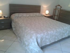Ένα ή περισσότερα κρεβάτια σε δωμάτιο στο Casa Azalea