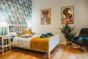 Posteľ alebo postele v izbe v ubytovaní FatCat Apartments