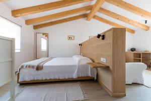 Postel nebo postele na pokoji v ubytování L'Abbraccio della Quercia - Suites
