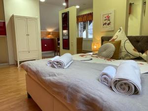 a bedroom with a large bed with towels on it at Fewo Jax in Boos