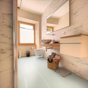 bagno con lavandino, servizi igienici e specchio di Rustico Mulino1 - Fully Renovated Near Locarno and Ascona a Minusio