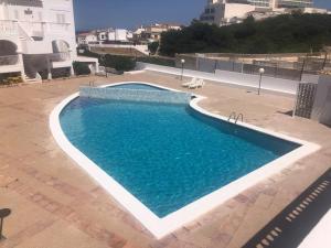 a large swimming pool on top of a building at Arenal den Castell Castellsol in Arenal d'en Castell