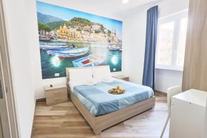 Ένα ή περισσότερα κρεβάτια σε δωμάτιο στο B&B MARE E POESIA Salerno