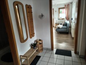 a hallway with two large mirrors on a wall at Ferienwohnung Fahrner in Baiersbronn