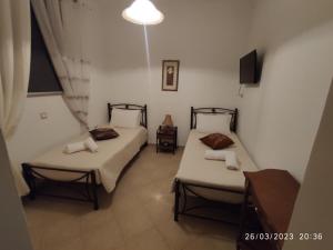 Postel nebo postele na pokoji v ubytování CORFU MAGDAS HOLIDAY