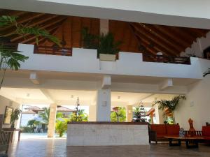 a lobby of a building with a staircase in it at Residencial Paraiso Bayahibe in Bayahibe +9 photos