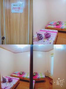 Rúm í herbergi á TRIPLE JS INN-SAGADA