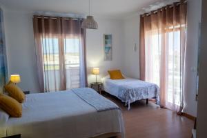 Postel nebo postele na pokoji v ubytování PKSC Surf House