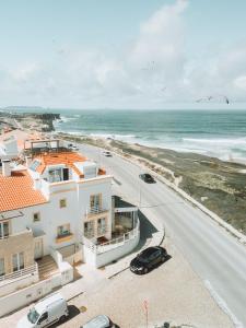 an aerial view of a road and the ocean at PKSC Surf House in Peniche
