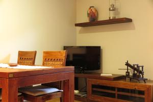 TV a/nebo společenská místnost v ubytování Apartamentos Casa Pochetas