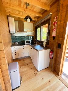 a kitchen in a tiny house at Mountain Eco Shelter 4 in Funchal