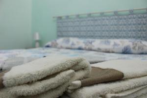 A bed or beds in a room at Casa Vacanze Nonna Franca
